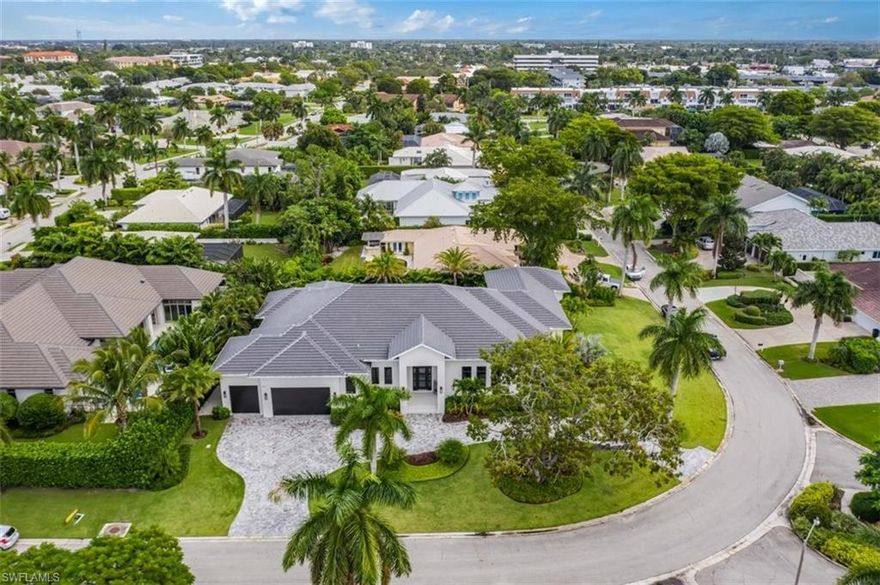 This brand new custom estate is built by Pezano Construction and is situated on an impressive corner lot and is built with sleek elements that makes this a sought-after gem in the Naples area. Rooms are spacious, and include 4 full bedrooms plus a den, 5 full bathrooms and one half bath, all spread over 4,500 square feet under air and 6,500 square feet total. Upgrades and other room notables will be only fitting for a home of this magnitude, and include a dramatic glass front door entry, wood coffered and tray ceilings for added appeal, gourmet kitchen with fine modern stainless appliances and custom cabinetry with built in breakfast island, custom tile and wood flooring throughout, large glass sliding doors that help bring the outdoor beauty in and much more. The lanai is a true retreat, with a spectacular pool and spa with a sun shelf and water features, a outdoor kitchen, and a fire pit with a large seating area overlooking serene backyard. This home is within walking distance to Venetian Village and Park Shore offers a private beach association.