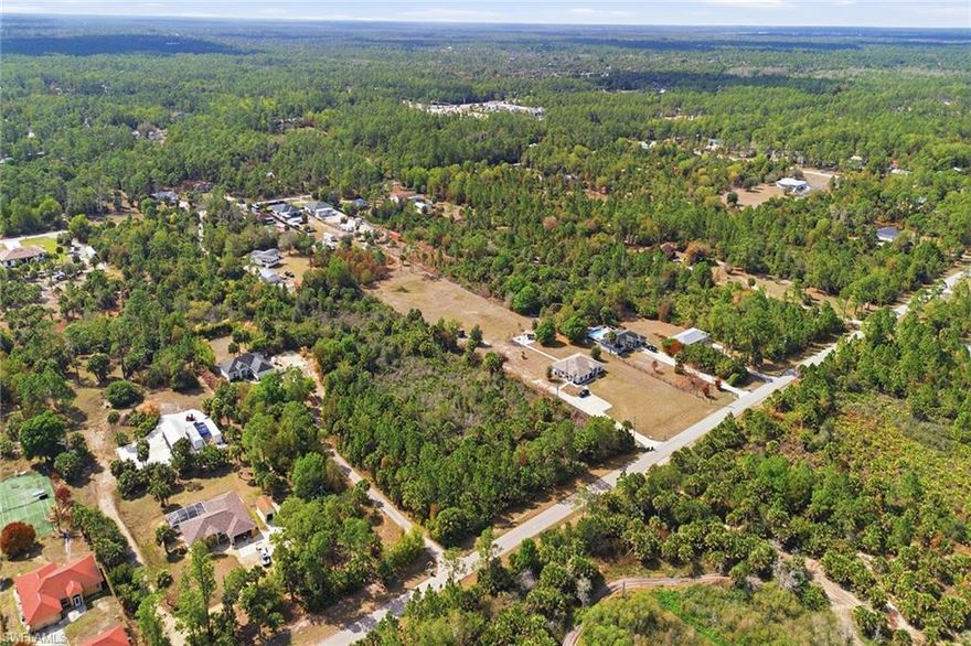 Seize the chance to craft your dream estate on this 1.14-acre home site in the heart of Golden Gate Estates, where privacy, expansive space and natural beauty converge seamlessly. This oversized lot, enveloped by mature trees and open skies, offers unparalleled flexibility to design a custom luxury residence. Ideally for those seeking acreage living with urban convenience. The property is minutes from shopping, dining, A-rated schools and world-class beaches, blending serene countryside tranquility with easy access to Naples finest amenities. Wetland report in supplements. Buyer to do their due diligence.