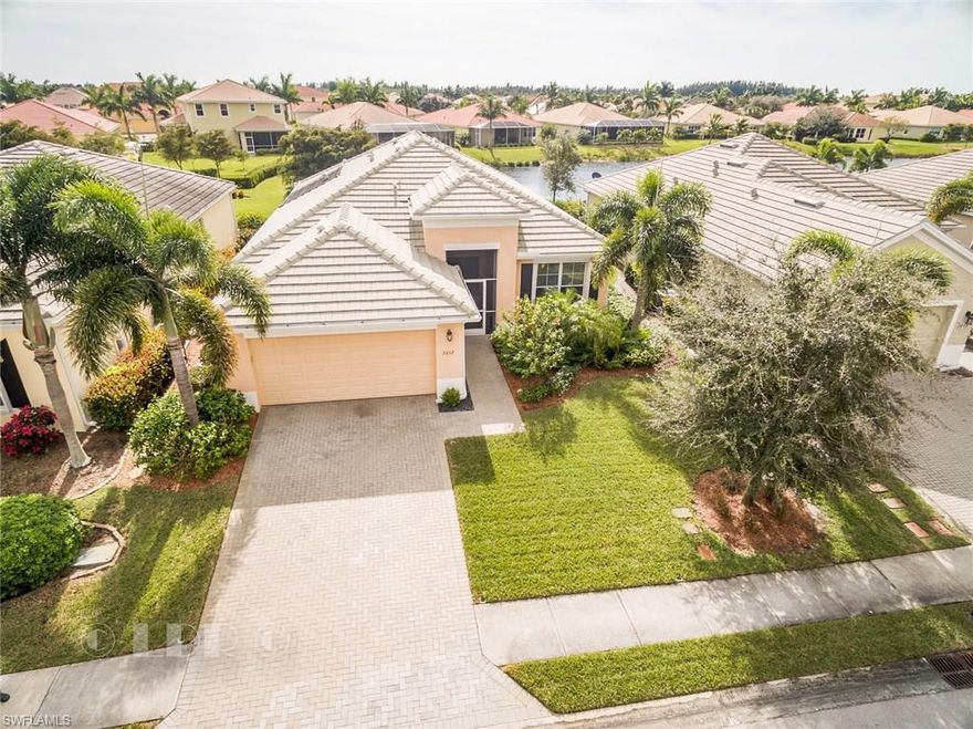 Come see what everyone's talking about: Sandoval! A WCI, Award winning community with miles of lushly landscaped paths leading to the resort style pool, community center with fitness, tennis, basketball, volley ball, dog park and a full time activity director.. This 2010 SOUTHERN exposure LAKE, pool home is better then new with all of the designer upgrades the owners have lovingly added :CROWN molding to enhance the family rooms volume ceilings and DISAPPEARING SLIDING glass doors to view the lake and pool, new GRANITE counters to accent the beautiful tall kitchen cabinets, deep stainless sink with new faucet, wood look porcelain tile floors in all bedrooms,(no carpet anywhere) SALT chlorinating,SOLAR heated pool with non heat custom, sparkling shell infused PAVERS, pebbletec interior finish, wainscoting & custom trim and chair rail in dining room , new faucets, ,new top of line refrigerator. Storm shutters on all openings. This home has a very desirable floor plan , 3 bedrooms, 2 bath,split plan with master at the back with lake views and huge kitchen with dining area and in addition has a flex room upfront that can easily be an office or formal dine. Come visit and Welcome home!