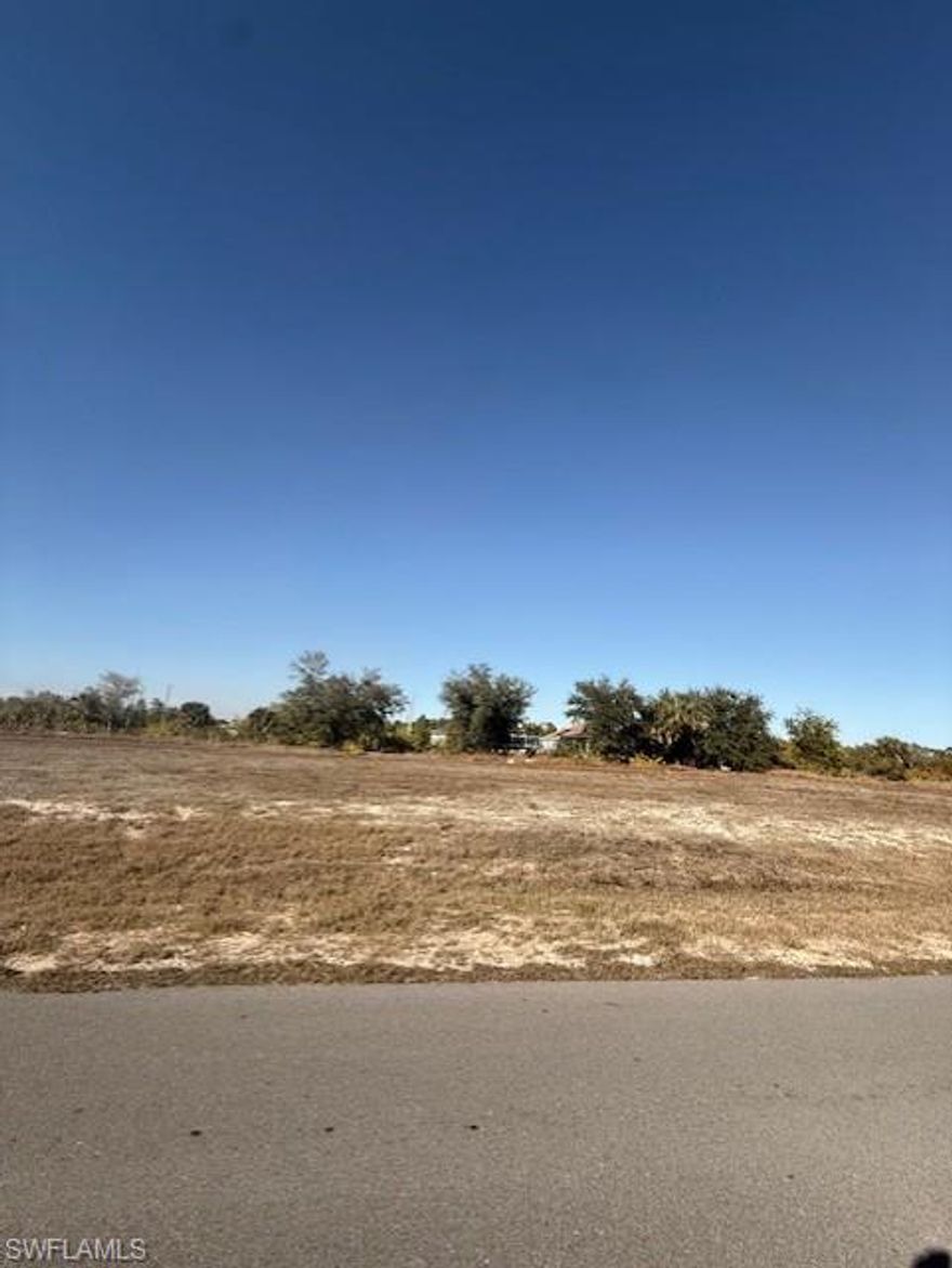 Oversized cleared canal lot with public utilities available, new construction going up all around.  Close to Del Prado & Kismet.