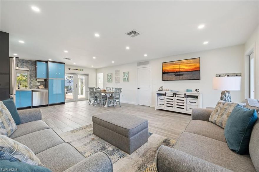 Welcome to this stunning 4-bedroom waterfront pool home, thoughtfully redesigned from top to bottom to create a true private retreat. Every major upgrade has been completed, including a new metal roof, impact windows and doors, spray-foam insulation, updated electrical and plumbing, and all-new A/C and pool equipment. The interior showcases elegant tile plank flooring, a custom-designed kitchen, modern upgraded bathroom fixtures, custom blinds in every room, and abundant natural light complemented by stylish lighting throughout. Step outside to your own resort-style oasis featuring a new saltwater pool, fire pit, new seawall, 16k dock, and lift which is perfect for enjoying the waterfront lifestyle. Lush landscaping and fencing enhance the sense of privacy, making this home feel like a secluded escape. Located in desirable Bayview Acres just minutes from open water, this property is being sold turnkey and offers plenty space for parking. Simply bring your bathing suits and start living the Florida lifestyle.