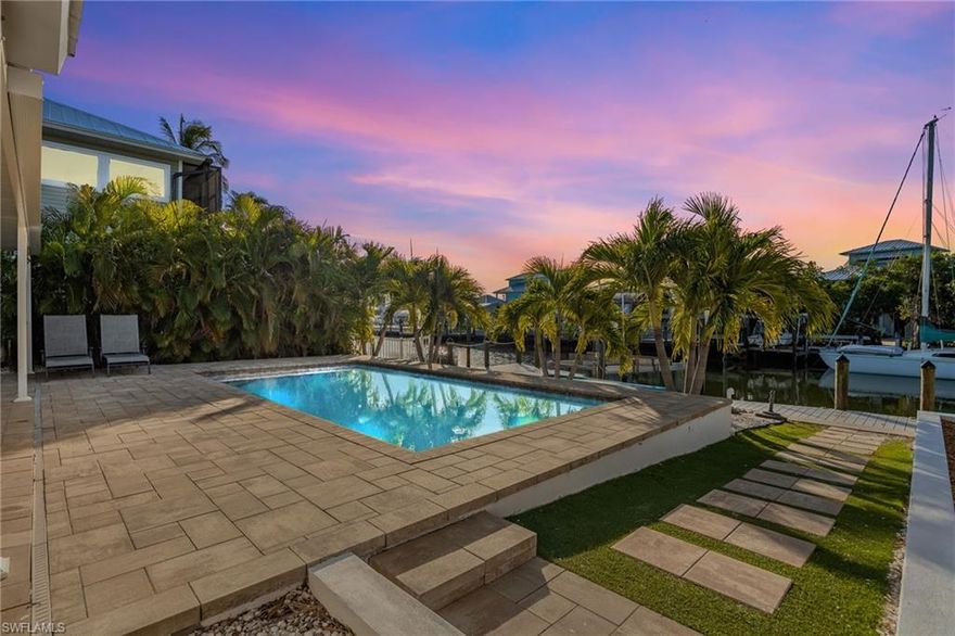 Welcome to this stunning 4-bedroom waterfront pool home, thoughtfully redesigned from top to bottom to create a true private retreat. Every major upgrade has been completed, including a new metal roof, impact windows and doors, spray-foam insulation, updated electrical and plumbing, and all-new A/C and pool equipment. The interior showcases elegant tile plank flooring, a custom-designed kitchen, modern upgraded bathroom fixtures, custom blinds in every room, and abundant natural light complemented by stylish lighting throughout. Step outside to your own resort-style oasis featuring a new saltwater pool, fire pit, new seawall, 16k dock, and lift which is perfect for enjoying the waterfront lifestyle. Lush landscaping and fencing enhance the sense of privacy, making this home feel like a secluded escape. Located in desirable Bayview Acres just minutes from open water, this property is being sold turnkey and offers plenty space for parking. Simply bring your bathing suits and start living the Florida lifestyle.