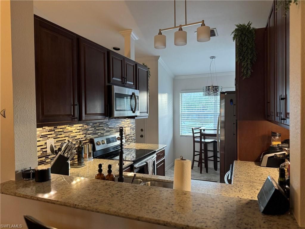 Photo of 181 Grand Oaks WAY #Q203, NAPLES, FL 34110 (MLS # 226020152)