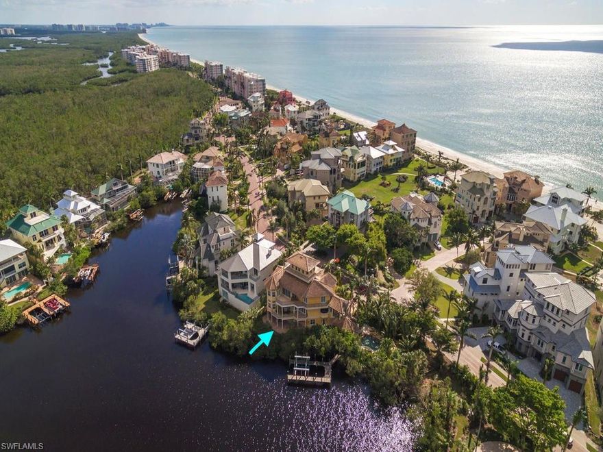 H.13806 - Walk to the Gulf of Mexico and award winning Barefoot Beach. This stunning custom home has views of the Bay from every room with panoramic Gulf views from the Observatory. This spacious 5 bedroom, 5 bath floor plan is perfect for entertaining, with gourmet kitchen, expansive balconies, resort style pool and an outdoor kitchen that seats 10 for alfresco dining. The Master Suite has a large walk in closet and gas fireplace. Impact doors and windows throughout. The boat dock is included with a 20k lift and direct Gulf access. Barefoot Beach is located in COLLIER County and one of it's most prestigious neighborhoods. The Club at Barefoot Beach is a private, member owned club offering a lifestyle of leisure, fun and a calendar of social events. The Club is located directly on the Gulf of Mexico amid several acres of tropical paradise. The Club is available but not included.