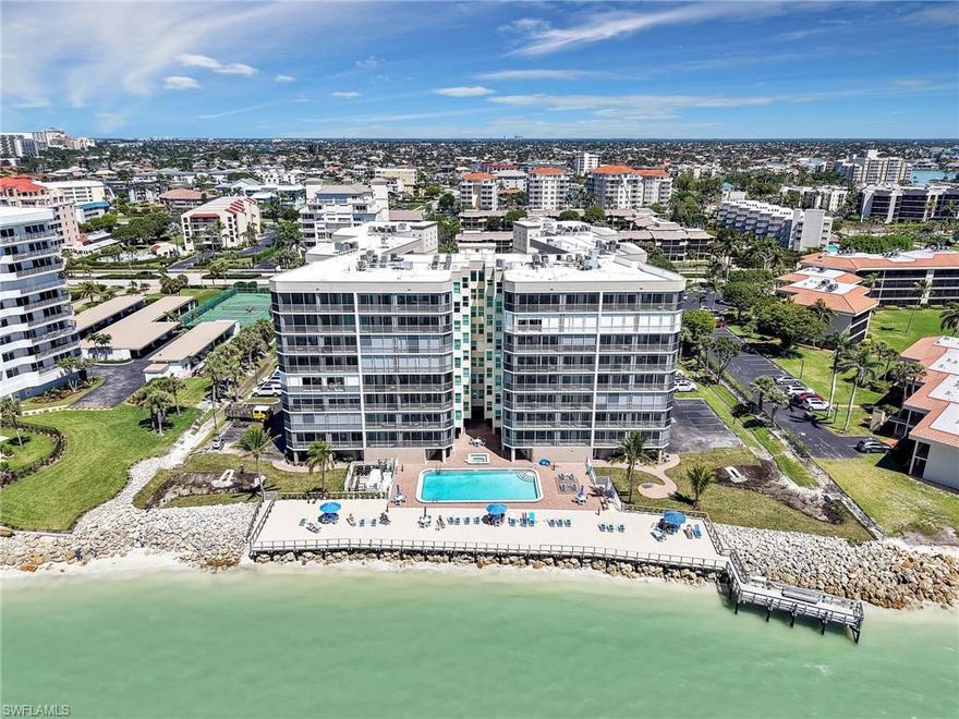 ULTRA RARE 4 BED/4BATH GULF-FRONT CONDO! Experience the pinnacle of Gulf-front living in this exceptionally RARE 4-bedroom, 4 FULL bathroom residence, offering over 2,000 square feet of beautifully designed open-concept living space. Perfectly positioned to capture stunning Southwest Gulf views, this exquisite furnished condo is a masterpiece of comfort and elegance. Step inside to an open-concept kitchen that seamlessly blends into the spacious living and dining areas, all framed by sliding glass doors and windows showcasing breathtaking sunsets. Three of the four bedrooms feature private en-suite bathrooms, providing ultimate privacy and convenience. The deeded two-car garage (#1) is ideally located within the building for easy access. Electric storm shutters provide peace of mind, ensuring security during any season. Indulge in a resort-style lifestyle with exceptional amenities, including a huge sundeck overlooking the Gulf, a heated community pool and spa, and a vibrant social calendar featuring weekly happy hours. Stay active with tennis and pickleball courts, an exercise room, and a well-appointed library for quiet relaxation. Beach access is just a short stroll down the street to the south beach entrance. This is a once-in-a-lifetime opportunity to own a 4-bedroom 4-bathroom Gulf-front retreat with unmatched exclusivity and amenities.