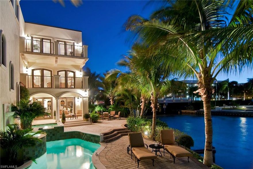 Luxuriously appointed waterfront villa offering exquisite views overlooking the bay from your oversized outdoor entertaining area with multiple seating areas. An end unit, residents will appreciate the copious amounts of glass which allows natural light to stream through and from which to enjoy the wrap around view. This unique residence allows for all the amenities of a home such as a private pool, spa, outdoor water feature and deeded boat slip while also sharing in the ease of condo living with secure gated entry and shared exterior maintenance. With 4,500 square feet, 4 bedrooms, multiple balconies and quick access to the Gulf, this villa has much to offer. Vista Royale is centrally located just a short distance to the soft sandy beaches and the gourmet shops and dining in the Venetian Village as well as downtown.