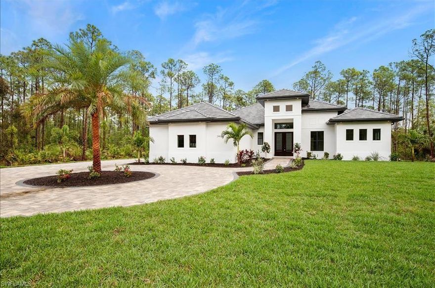 WOW!A MASTERPIECE OF SOPHISTICATION AND TRUE CRAFTSMANSHIP IN BONITA SPRINGS HAS COME AGAIN FROM THIS CUSTOM BUILDER! THIS ESTATE NESTLED ON 1.25 ACRES OF FLORIDA PINES IS LOCATED ON ONE OF THE MOST SOUGHT AFTER LOTS IN THIS NEIGHBORHOOD!EASTERN EXPOSURE UPLAND LOT IS NOW DEVELOPED INTO A STUNNING HOME AND READY FOR MOVE IN!THE PICKIEST OF BUYERS WILL BE HAPPY YOU BROUGHT THEM HERE! NO HOA! NO RESTRICTIONS! PRIVACY! FANTASTIC LOCATION!4 BEDROOMS+DEN 3 FULL BATHROOMS WITH A 3 CAR OVERSIZED GARAGE AND CUSTOM DESIGNED CIRCULAR DRIVEWAY THAT SURELY COULD FIT 20 CARS! PGT WINGUARD IMPACT RESISTANT WINDOWS AND DOORS,PORCELAIN TILE THROUGHOUT THE ENTIRE HOME, SILVER TRAVERTINE IN PATIO AREA,5 TON 16 SEER HVAC,GRAND KITCHEN WITH GORGEOUS ISLAND FEATURING EXOTIC QUARTZITE COUNTERTOPS& WHITE SOFT CLOSE CABINETS,UPGRADED LANDSCAPE PACKAGE WITH MATURE PALMS AND VARIOUS NATIVE FLOWERS & PLANTS,5 ZONE IRRIGATION SYSTEM,UPGRADED WOOD SHELVING IN ALL CLOSETS,KITCHEN AID APPLIANCE PACKAGE,LAUNDRY ROOM W/MAYTAG FRONT LOAD WASHER AND DRYER AND SINK.A PROPERTY YOU DON'T WANT TO MISS OUT ON!NEAR EVERYTHING YOU WOULD NEED! BRAND NEW CONSTRUCTION WHICH COMES WITH SEVERAL WARRANTIES!EASY TO SHOW!