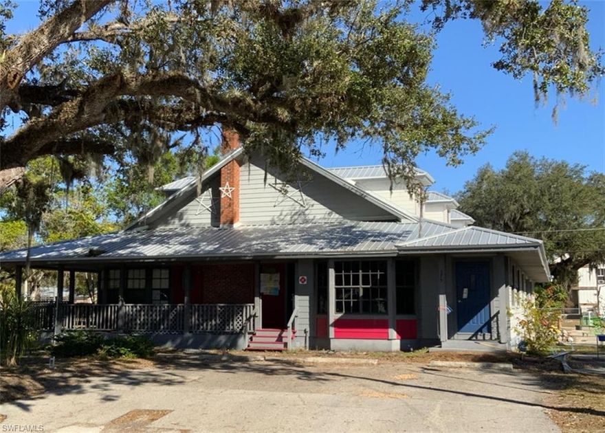 Picturesque Old Florida style building on Main Street in historical area of LaBelle on oak laden Main Street one block South of Barron Library on East side of street.