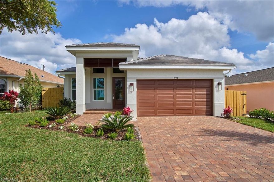 Imagine yourself in this fabulous, brand new home, nestled between the Gulf beaches and all the convenience that North Naples has to offer. With 4-Bedrooms plus Den, 3-Baths, and a 2-Car Oversized Garage, this home features upgraded 8-foot interior doors, 20-inch porcelain tiles, and impact resistant doors and windows throughout. Entertaining is a breeze in your private fenced backyard, the perfect spot for relaxing by your pool and spa. The kitchen is a gourmet cook’s dream with a center island, stainless steel appliances, glass slide range, French door refrigerator, stainless vent hood and built-in microwave. The all-wood cabinets with granite countertops, decorative wainscotting and tile backsplash complete the look. In the master bath is an oversized, 96-inch-tall frameless shower enclosure and brushed nickel fixtures. All Bathrooms have upgraded wall tiles with frameless enclosure and granite countertops. The attractive exterior has concrete tile roofing, upgraded landscaping, irrigation and sod package, brick paver drives and walkways.