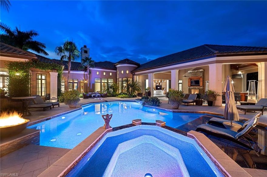 Nothing compares to this stunning custom home built by BCB with interiors by Collins DuPont. Offering a southeastern exposure with layered views over lake and preserve, you'll be drawn to the timeless travertine floors that are enhanced by custom inlays and warm Brazilian cherry wood custom millwork found throughout the home and encompassing the oversized study. Throughout this completely automated smart home, each room features exquisite custom ceilings, lighting details and natural light.  The exception - the 8-seat home theater. Perfect for a night in! Inspiration lives in the upscale gourmet kitchen that offers luxury appliances including two Sub-Zero refrigerators, four refrigerator drawers, two dishwashers, a warming drawer and more! This exceptional design opens to the family room and the oversized outdoor living area separated by automated 90-degree pocketing sliders and offering outdoor living at its finest! Retreat to the oversized sofa and enjoy the fireplace and outdoor television or relax in the saltwater pool adorned with fire bowls adjacent to the fire pit tucked away on its own. Located in the award-winning community of Mediterra, find yourself at home!