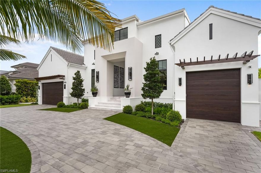 Experience modern luxury in this brand-new Moorings estate built by renowned Borelli Construction. Spanning 4,400 square feet on one level, this residence offers five en-suite bedrooms, with one designed as a private office with soaring ceilings. Fully furnished and styled by Clive Daniel Home, the interior showcases custom wall treatments, designer finishes, and thoughtful details throughout. The chef’s kitchen is complemented by a spacious butler’s pantry functioning as a fully equipped second kitchen, while the stunning great room boasts a dramatic ceiling with LED accent lighting. Wolf and SubZero appliances, European white oak flooring, Samsung Frame TVs, Crestron home & lighting automation, and a whole house generator provide the ultimate in luxury and convenience. The lanai features motorized screens and shutters for comfort and storm protection, while the desirable eastern exposure delivers year-round sun on the pool and a shaded lanai at sunset. Third-level pull-downs in the primary closets maximize storage. Located west of Crayton Road across from waterfront homes, this elevated residence meets current FEMA requirements for the home and all mechanicals. Its central location offers quick access to the private Moorings Beach access and all that Naples has to offer.