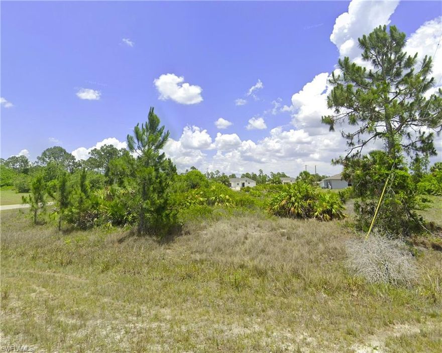Discover this oversized corner lot located in the desirable Southeast area of Lehigh Acres. Enjoy easy access to Downtown Fort Myers, Veterans Park, recreation centers, SR-82, I-75, local churches, gas stations, hospitals, shopping centers, schools, and the airport. The property is ready for your new build—an ideal spot to construct your dream home. A nearby utility pole ensures convenient access to electricity for future homeowners. Agents, please refer to the Confidential Remarks for more information.