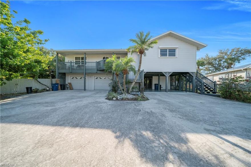 This fabulous income property is now available with close proximity to Ft. Myers Beach. The duplex sits on pilings with a two car garage below the larger unit and a double carport below the smaller side. The extra large, pie-shaped lot is fenced and filled with lush landscaping for privacy. This property has always been a great rental due to the close access to the beaches. Choose to rent out both sides, or live in one side and rent the other.  The larger side is a 2/2 with a full 2 car garage below which includes an interior stairway leading up to the kitchen. Some extras include the in-unit laundry, beautiful upgraded kitchen, high ceilings, electric fireplace and bonus area in the master suite for an office, or even a work out area. The smaller unit is a 2/1 with a large enclosed laundry room off the 2-car carport. A great screened in lanai area looks over the fenced back yard. The building has full storm protection and an approximately 3 year old roof and AC units. Seller financing is available for a qualified buyer. Be sure to see the attached video tour.