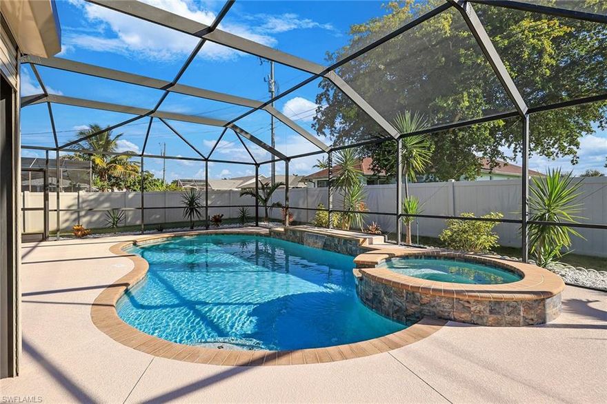 Welcome to your private pool and spa oasis in the heart of Cape Coral! Enter into this beautiful three-bedroom, two-bath pool home and feel the balance of style, comfort and peace of mind. Inside, natural light fills the spacious open layout designed for easy everyday living and effortless entertaining. The heart of the home opens seamlessly to your extended screened lanai, where you’ll fall in love with the exceptional sparkling saltwater pool and spa featuring a self-cleaning system, electric heater, color-changing pool LED lights, a soothing waterfall feature, and freshly painted pool deck. Best of all, with the Pentair automation system, you can control and monitor your pool right from an app on your phone, including adjusting the temperature, changing the lighting, monitoring salt levels and checking the water from anywhere in the world. Enjoy year-round comfort and security with a new roof (2023), electric roll-down shutters on the front door, window and lanai, and accordion shutters on side of the home. A full-house gas and propane generator ensures peace of mind during any season. The fenced yard with dual gates provides privacy and convenience for pets and outdoor activities. Close to shopping, dining and everything Cape Coral has to offer. See why this one checks all the boxes, schedule your private showing today and fall in love with your next home!