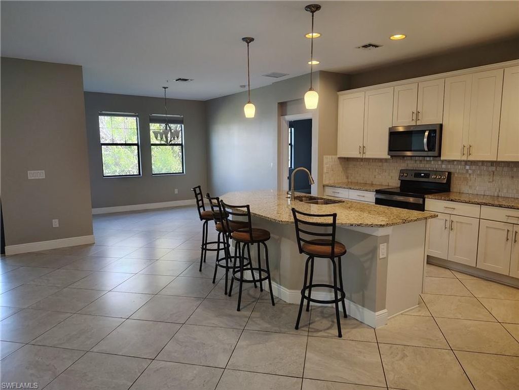 Photo of 15188 Butler Lake DR #202, NAPLES, FL 34109 (MLS # 225082625)