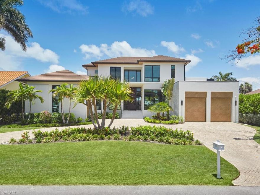 Exceptional Aqualane Shores Retreat.
Discover this stunning custom-built five-bedroom haven in coveted Aqualane Shores, mere steps from Naples’ pristine beaches and vibrant 3rd Street South. Nestled on a picturesque waterside lot, this 5,900+ sqft under-air masterpiece boasts an additional 1,200 sqft of finished outdoor living space, perfect for soaking in the breathtaking pool and water views.
This magnificent home showcases a stunning layout, beginning with a double-height foyer featuring front-to-back views. The expansive Great Room impresses with trimmed ceiling, central fireplace surrounded by natural stone, and leathered walls, blending seamlessly with a custom-built banquette seating area centered around a luxurious oversized kitchen. Designer features include Wolfe, Sub-Zero and Miele appliances paired with natural wood cabinetry.
The unique Club Room stands out with textured walls, lacquered cabinetry, bar, lush finishes and designer lighting. A sizable Owner's Suite and second bedroom complement the first floor's amenities. A striking floating natural wooden staircase invites exploration of the serene second-floor lounge, convertible to a sixth bedroom, overlooking the water. Three spacious en-suite bedrooms, two with channel views and balconies, and a second laundry room complete the upper level.
Contemporary windows provide natural light throughout, illuminating a fresh palette of crisp grey hues, clean lines and custom finishes including wide plank French oak flooring. Additional amenities include a completely finished Butler Pantry, elevator, summer kitchen, spa, waterside fire pit with built-in seating, first and second-floor laundry, smart home features and a 3-car garage with lift capacity and generator.
Located on quiet and coveted 16th ave S, this extraordinary home is built to latest construction standards offering the ultimate lifestyle experience with direct boating access to beautiful Naples Bay.