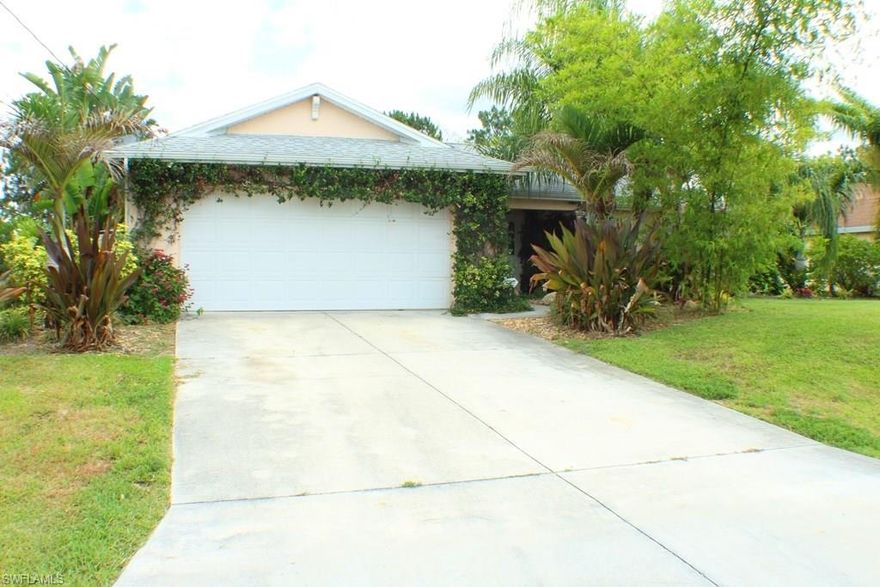 Welcome to your wonderful South Lehigh Acres home! You are sure to be charmed with the care of ownership and the thought that was applied to the many tasteful upgrades.  18-inch tile on the diagonal, crown molding, a reverse osmosis system, and beautiful granite countertops are but a few of the upgrades that add to the allure of this home.  With over 1650 square feet, the open floorplan is very roomy and functional, with the kitchen opening up to the family room and separate dining area.  Part of the lanai has been enclosed, and can be used as a formal dining area or extra living space.  The master bedroom and bathroom are amply sized, and the guest bedrooms contains more than enough space. Then den (or home office) is accessed by beautiful french doors.  The laundry room connects to the 2 car garage and has plenty of cabinet space for storage.  You will be in awe of the home's beautiful and mature landscaping; it feels like paradise. The convenience of Bell Boulevard just a very short distance away will make commuting around town a breeze!  This is a great opportunity for a family! Schedule a showing today; you will definitely not be disappointed!