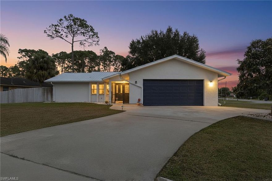 Recently remodeled from top to bottom! This updated single-family home is tucked away in a quiet, cozy pocket of Lehigh Acres and sits on an oversized corner lot. Inside, you’ll find new luxury vinyl plank flooring, tiled bathroom floors and showers and granite countertops in every space! Outside upgrades include a metal roof and gutters installed in 2023 - an uncommon and sought-after feature, new fencing added in 2023, and an A/C system just 5 years old. Enjoy the charm and benefits of mature apricot, mango, avocado and ackee fruit trees, providing fresh fruit from your own yard! The garage offers a versatile 4th room with central air, ideal for a home office or hobby room. 

A chef's dream! The large galley-way designed kitchen is both stylish and functional, featuring abundant white shaker-style cabinetry, sleek granite countertops, and Whirlpool stainless steel appliances. With generous counter space, this kitchen is ideal for everyday living and entertaining. Natural light fills the breakfast area through multiple windows, while French doors open to a large screened-in lanai overlooking the northeast-facing backyard—offering soft morning sun and cooler, shaded afternoons, ideal for outdoor dining or relaxation!

Ideally located near shopping, dining, and everyday conveniences along Lee Boulevard. Golf courses, parks, nature preserves, and Gulf Coast beaches are also all within easy reach. This home has it all, schedule your private showing today!