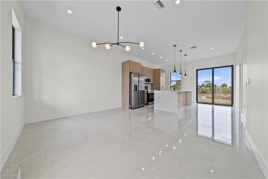 Welcome to this brand new construction home in Lehigh Acres, ideally located just minutes from State Road 82 with quick access to Fort Myers, shopping, dining, and major commuter routes.

This 3 bedroom, 3 bathroom home is designed for the way today’s buyers actually live, offering a modern open layout filled with natural light, clean lines, and high quality finishes throughout. The spacious kitchen flows seamlessly into the main living and dining areas, creating a functional and inviting space perfect for everyday living or entertaining.

One of the most unique features of this home is the third full bathroom with a private entrance off the garage. This flexible space offers endless possibilities and can easily be converted into a private studio, guest suite, in law quarters, home office, or additional living area, making it ideal for multigenerational living or buyers looking for extra versatility.

The primary suite is thoughtfully positioned to provide privacy and comfort, featuring a spacious layout and a well designed en suite bathroom. The additional bedrooms are generously sized, offering flexibility for family, guests, or work from home needs.

Located in a growing area of Lehigh Acres with no HOA, this home offers the convenience of new construction with modern systems, energy efficiency, and low maintenance living. Enjoy being just a short drive from Fort Myers, SR 82, schools, shopping centers, and restaurants.

If you are searching for a move in ready home in Lehigh Acres that offers flexibility, modern design, and a prime location near Fort Myers, this property is one you do not want to miss.