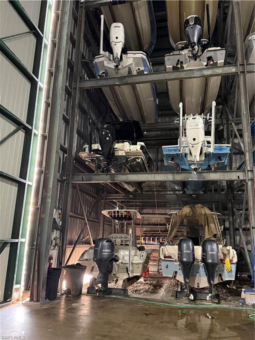 Opportunity for a large dry boat storage condo on Bonita Beach Rd. Second level boat slip available that can accommodate vessel measuring 30'L x 11'H x 9'W max vessel dimensions. Facility is professionally managed and staffed 7 days per week. With 1 hour notice your boat is launched, ready for your arrival. Minutes to the Gulf via Wiggins Pass or New Pass. On site fuel, pump out station, fish cleaning station, ice, refreshments and 24 hour restrooms with showers and near multiple restaurants on Bonita Beach Road.