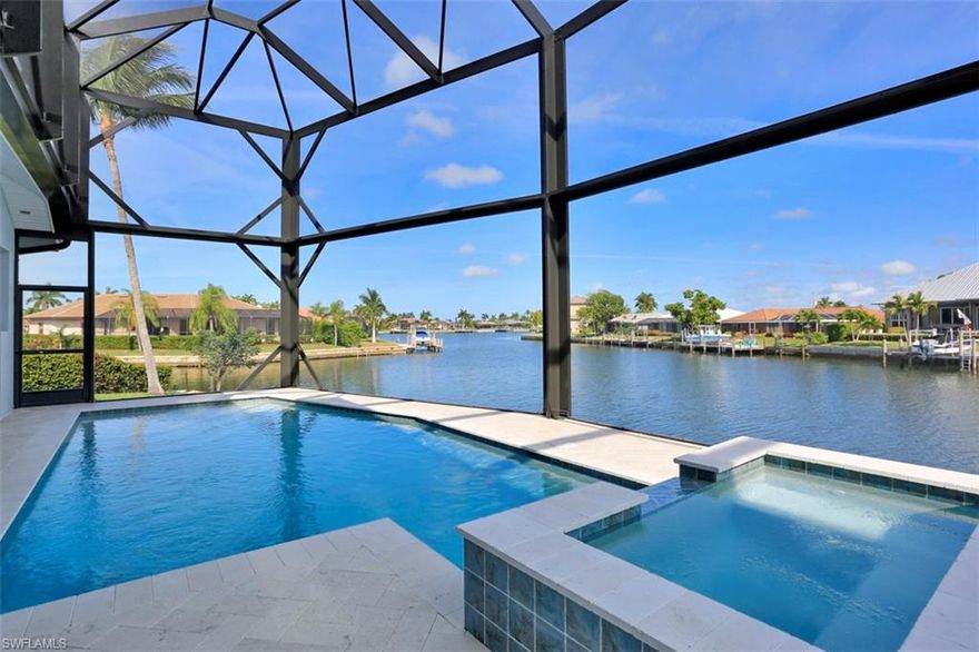 BRAND NEW Custom built home with over 3200 sq feet under air situated around 181 feet of water frontage on a TIP lot with wide water views that creates an extensive outdoor experience with covered panoramic view lanai and stunning shell stone flooring, pool and spa with summer kitchen, 4 bedrooms 3 and 1/2 baths plus den, Chef's kitchen with great views, home flows great with high ceilings and open spaces all around, quality craftsmanship, fine materials, 2 master suites and a 2nd floor balcony to enjoy sunsets with stunning wide water views. The indoors and outdoors blend together to enjoy the Marco Island lifestyle. Less than 15 minutes out to the Marco River for boating, 3 car garage with epoxy floors. A great opportunity to acquire a rare tip lot new home with wide water views!