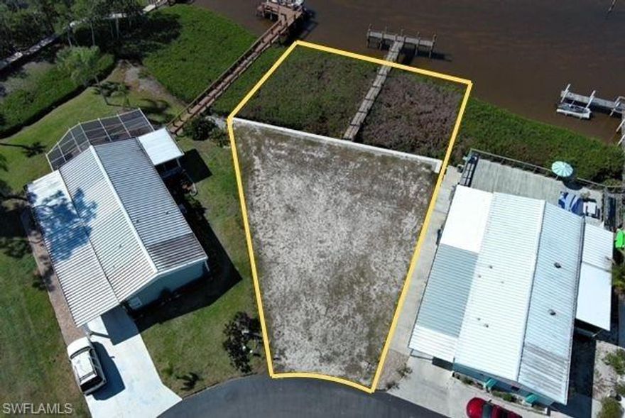 Enjoy stunning sunset views right from your future backyard on this prime west-facing lot with a brand-new dock (installed 2025) and direct Gulf access via the scenic Spring Creek waterway. Perfect for building your dream home, the property delivers beautiful evening skies and immediate water access with an existing dock ready for kayaks or powerboats. You’re just minutes from Coconut Point, RSW Airport, upscale dining, and major shopping. Paddle scenic back bays, reach New Pass or Dog Beach by kayak, or take a quick 15-minute boat ride to open water. Morning coffee or evening relaxation comes with preserve views and frequent sightings of dolphins, manatees, and Estero Bay wildlife.
This peaceful, Hawaiian-inspired 55+ community features a clubhouse, heated pool & spa, tennis, shuffleboard, bocce, an activity center, and a stocked freshwater lake—all with low HOA fees. Conveniently located near Hyatt Coconut Point, across from Coconut Point Mall, and close to new medical facilities, the serene setting offers the best of coastal living without the noise of main roads.