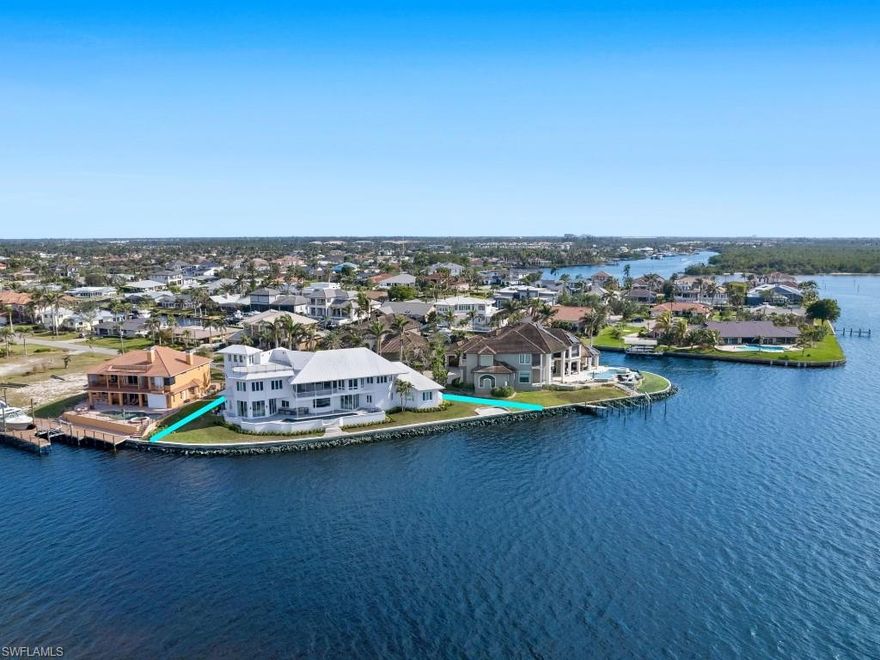 Discover an extraordinary opportunity to own one of the BEST waterfront homes in Southwest Florida. Located in Town & River, one of areas BEST boating communities, this stunning contemporary coastal retreat offers 234 feet of pristine water frontage, providing breathtaking panoramic water views and mesmerizing sunsets from nearly every room. Designed by renowned architect Dan Sater, this elevated, weatherproof masterpiece blends elegance, functionality, and modern sophistication. Situated at the end of a private cul-de-sac on one of the largest and BEST-positioned lots, this home boasts deep-water direct Gulf access, making it a true paradise for boating enthusiasts. Unlike many waterfront properties, the shoreline here allows ample space to build your dream dock without obstructing the stunning views. Inside, the sprawling open floor plan is designed for both grand entertaining and comfortable everyday living. The home features expansive living, dining, and family areas on both levels, along with two staircases and an elevator for seamless flow. The gourmet kitchen is equipped with top-of-the-line appliances, while a 385-bottle wine room is perfect for collectors. Additional highlights include a european white oak floors, game room, exercise room, two spacious office areas, and a huge VIP suite with oversized his-and-hers closets. For added intrigue, a secret room is tucked away, and practical luxury is ensured with a full-house generator, impact windows, and an oversized three-car garage. Step outside and experience true resort-style living. The expansive outdoor area features a huge pool overlooking the inter coastal waterway while the large yard offers plenty of space for children and pets to play. One of the most unique features of this home is the rooftop observation deck, where you can take in breathtaking sunsets, stargaze, or watch the 4th of July fireworks. This home is more than just a residence—it’s a lifestyle. With an unmatched location, unparalleled water views, and luxurious finishes throughout, this is a one-of-a-kind waterfront residence.
