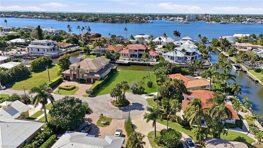 Discover the perfect opportunity to build your dream waterfront home in one of the most sought after waterfront communities in prestigious Royal Harbor. This premium lot is located at the end of a quiet cul-de-sac and near intersecting canals, offering quick and direct access to Naples Bay. Within minutes, you can be on your boat or jet ski heading to the Gulf of Mexico, paddle boarding, and kayaking, from your own backyard.
With 115 feet of waterfront, there’s ample room to accommodate a boat lift, jet ski lift, and more — the possibilities are endless. This property offers western exposure with plenty of beautiful sunsets and a blank canvas for a custom home builder to create a stunning residence with captivating outdoor living spaces. The location is key offering a quick bike ride to Downtown Naples restaurants, shopping, entertainment and pristine beaches.  
Experience the best of Naples’ coastal lifestyle in this prime waterfront location. Drive by and see the potential for yourself!