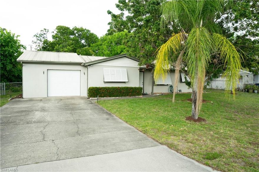 Here's your chance to own a 3 bedroom, 2 bathroom home in Fort Myers for an affordable price!  This charming home is nestled in the established neighborhood of Fort Myers Shores where you'll enjoy close proximity to I75, a public boat ramp, parks, restaurants, and shopping.  You'll appreciate the layout of this 1478 square foot home with a split bedroom design, updates in the guest bathroom and kitchen, an enclosed back porch allowing valuable extra living space, and an extended garage (15'x36') allowing space for a workshop/extra toys/or a second car.  This home has never flooded from any storms.  The metal roof and hurricane shutters bring peace of mind as well.  There's plenty of room on the 1/4 acre lot to let the kids and pets play in the fenced-in backyard.  The HVAC system is newer. Irrigation is run through the well saving money.  Whether you’re a first-time homebuyer, seasonal resident, or investor, this property checks all the boxes with no HOA fees and no rental restrictions.  Be sure to schedule a showing today!