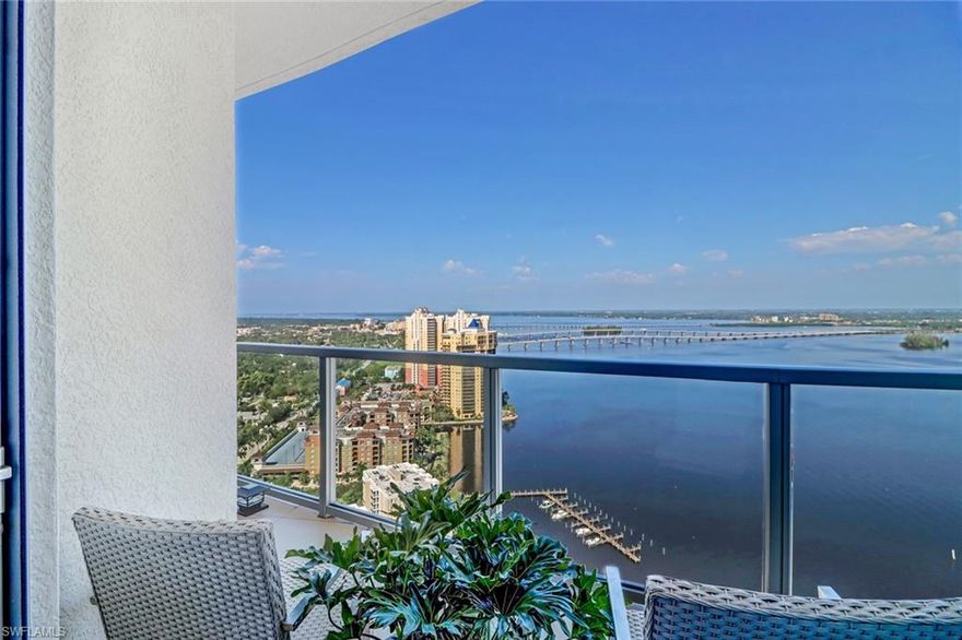 TOP FLOOR UPPER PENTHOUSE UPH5 Now vacant easy to show.
Spectacular TOP WATERFRONT PENTHOUSE on the 33rd floor (!) offering phenomenal views over the water, pool and even the city! This furnished luxury residence boasts an open kitchen with top of the line appliances, great views, a large living room, 2 bedrooms, 2 baths and an expansive lanai facing West! This previous model is furnished with Clive Daniel luxury furniture. Enjoy the upgraded kitchen with GE Monogram & Bosch Appliances and granite & marble countertops. Floor to ceiling impact windows and glass balcony railings allow for spectacular views! This penthouse features 10’ ceilings, elegant tile throughout incl. the lanai, a premium parking space! 1  prime storgage unit B on floor 16
The OASIS is the most contemporary skyrise in Fort Myers. Enjoy the world class amenities; tennis courts, resort style pool, state of the art fitness center, concierge service & more. Meet with your friends in the resident only lounge, billiards room & entertaining room. Located close to the revitalized Downtown River District with dozens of restaurants, bars, shops and galleries you will love the relaxed lifestyle of Southwest Florida!