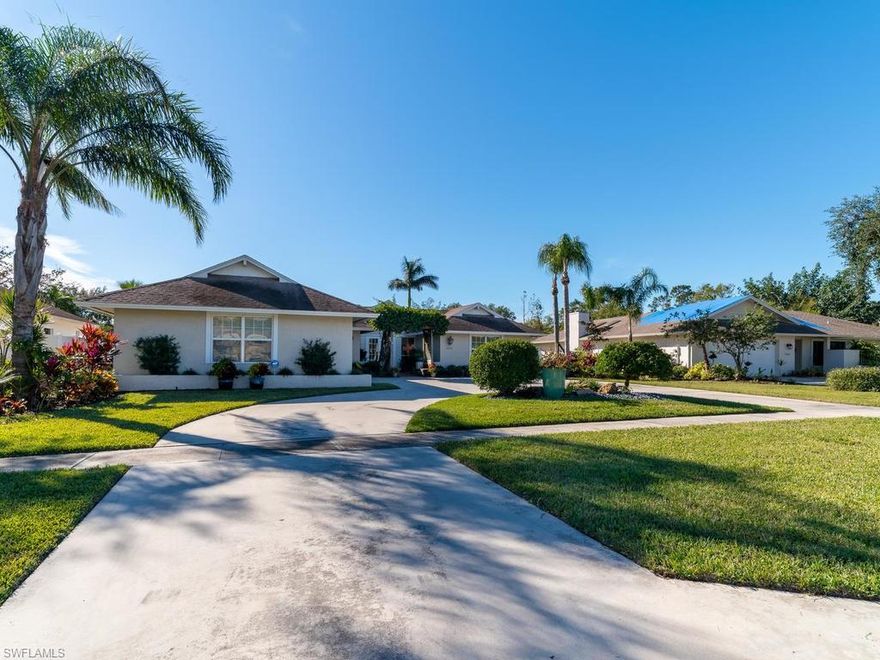 A new roof makes this former model home an opportunity, under priced with 2850 s.f. which includes 4 bedrooms, 3 baths, living room, kitchen, family room and dining inside and out. Pinewoods is conveniently located close to tons of shopping and restaurants off of Airport-Pulling and Pine Ridge, and only about 4 miles to the beach. This home architecturally has many features, including a vaulted living room with triangular windows, built-in crystalline fireplace and large sliding glass door openings leading to the pool. The pool is dramatic with vaulted lanai enclosure and outdoor dining area with chandelier and secluded views of the low maintenance SW Florida garden. The master bedroom has a walk-in closet and sliding glass doors out to the pool. Master has been updated with a new shower, a vanity with 2 sinks and carrera marble top. The kitchen has Bosch dishwasher, new stainless refrigerator, glass top range and large pantry. The kitchen and 2 bathroom vanities have been updated including granite counter tops. Fresh paint, newer tile throughout, custom blinds and drapes completes this home located with close access to tennis courts and park with low association dues of $250/year.