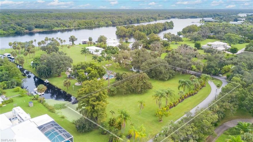 Looking for the perfect waterfront acreage property to build your own private estate in a quaint country setting?  Check out this gorgeous, cleared and ready to build on lot offering 1.42 acres of prime real estate located in a small, private gated community with direct access to the Caloosahatchee River. It’s the perfect spot for boating, fishing, watersports or simply soaking in the peaceful river views. The property is level and features beautiful, mature trees including oaks and palms and some landscaping that enhances both its beauty and privacy. Plenty of room at the end of the canal in a protected area for your new boat dock too just minutes to the river! Ideally situated just off I-75, it offers easy access to major roadways and is only minutes away from the rapidly growing Babcock Ranch, which includes new shops, a grocery store, and restaurants. For entertainment and cultural attractions, the lively Downtown River District is just a short drive away. With its generous size, unbeatable location, and serene riverfront setting, this lot offers an incredible opportunity to build your dream home in a tranquil yet convenient part of Alva.