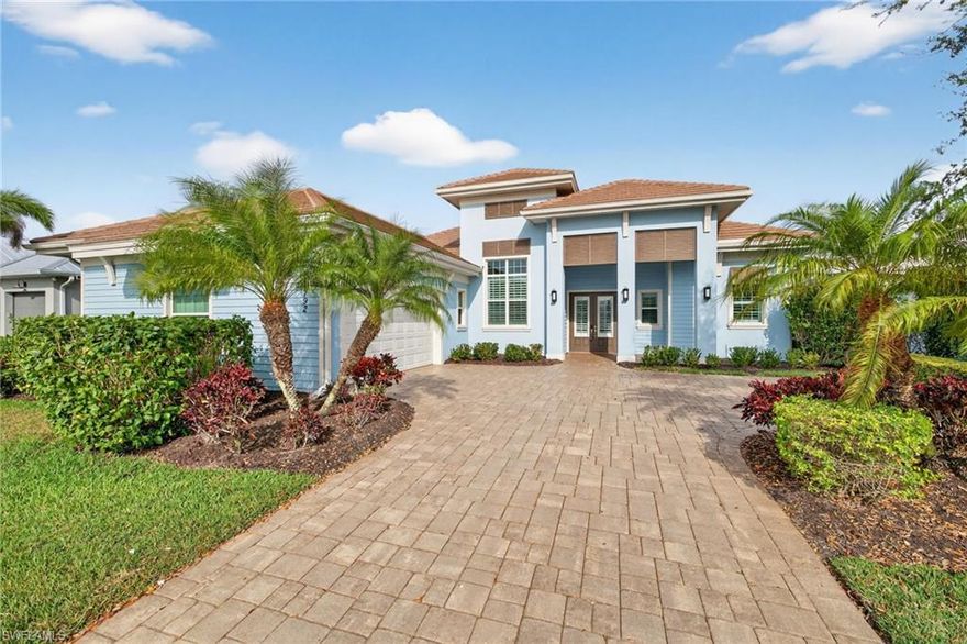 Experience resort-style living in the highly sought-after community of Naples Reserve. This beautifully designed Stock Development residence offers over 2,700 square feet of thoughtfully crafted living space with four bedrooms, a den, and 3.5 baths, blending modern elegance with the relaxed sophistication of Southwest Florida living.

The open great room features soaring ceilings, designer finishes, and expansive glass doors that seamlessly connect the interior to the outdoor living space. The chef's kitchen is the heart of the home, showcasing an oversized island, abundant cabinetry, and a layout ideal for entertaining.

Step outside to your private screened lanai where a sparkling pool and spa overlook tranquil lake views, creating the perfect setting for both quiet mornings and al fresco evenings. The spacious outdoor living area embodies the indoor-outdoor lifestyle that defines luxury living in Naples.

The primary suite offers a peaceful retreat with a spacious bedroom, spa-inspired bath, and generous closet space, while the additional guest rooms provide comfort and privacy for family and visitors.

Residents of Naples Reserve enjoy an exceptional amenity package including a resort-style pool, lakeside clubhouse, fitness center, tennis and pickleball courts, kayaking and paddleboarding, miles of walking trails, and a vibrant calendar of social activities.

This is a rare opportunity to enjoy a beautifully designed home in one of Naples' most desirable resort communities.