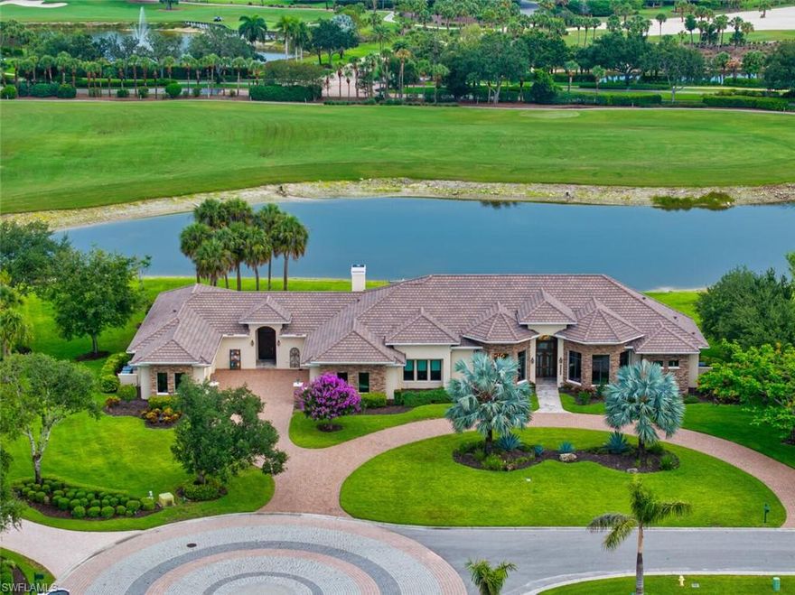 A magnificently custom-designed estate, (2016), where timeless craftsmanship meets modern luxury! Showcased on one acre, overlooking the 4th fairway of Twin Eagles Golf & Country Club's revered Talon Course, this home offers sweeping views of the lake and golf course from nearly every room! An additional four acres of land extend into the water and fairway, offering an unmatched sense of privacy and space. Warm, rich wood finishes, harmonized with other materials, set the tone of refined comfort and tranquility. Mahoghany and Leaded Glass doors, stained Oak trim, crown molding and solid doors, Cherry soft-close cabinetry throughout, Travertine stone gas fireplace with twisted Juniper mantel, as well as Walnut and Marble floors define the essence and character of the home.  Encompassed in 5,493sf, this ranch-style home has a sense of casual sophistication, tailored for everyday living, as well as grand entertaining. Centered around a spacious gourmet kitchen, with gas-cooking on professional-grade Wolf appliances, Sub-Zero Refrigerator/Freezer and a generous walk-in pantry, this home features 4 en-suite bedrooms, 5.5 bathrooms, a large game room with wet bar, two 2-car garages (4 bays) and 3 zoned HVAC systems, to mention a few. Upgrades include a whole house generator, hurricane impact glass throughout, plus electric shutters and screens for the oversized patio, for added comfort and security. Twin Eagles Golf & Country Club is abundant in wildlife and natural beauty. Residents often spot deer, wild turkeys and a variety of birds throughout the community. The Club offers a wide range of amenities, including golf, tennis, pickle ball, bocce, a fitness center with classes, a variety of hobbies, dining and social activities, for members to enjoy. Club membership is mandatory and the new homeowners can choose from golf, sports or social membership.