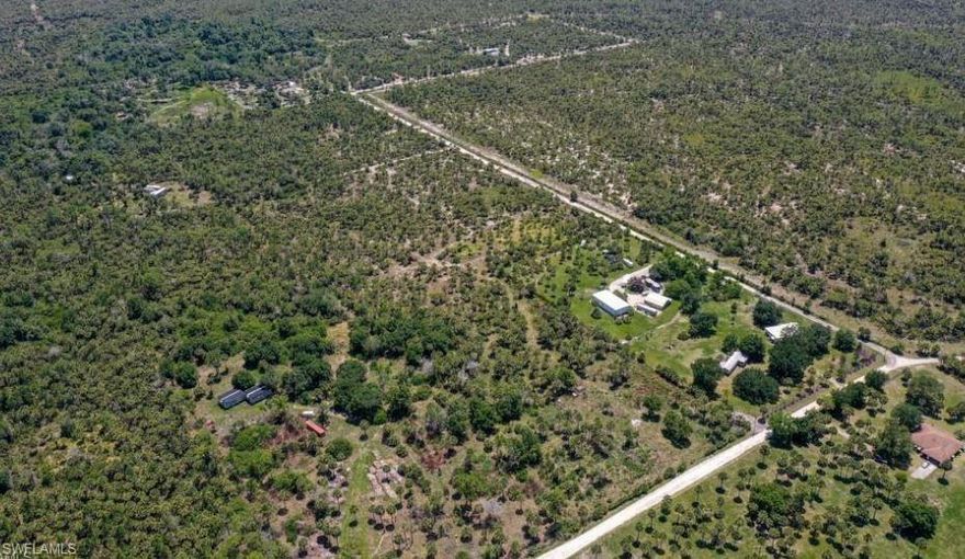 Discover this stunning 5-acre parcel of land, ideal for nature enthusiasts! With its vibrant woodlands and ample space for a barn and horses, this property offers endless possibilities for outdoor living and recreation. Whether you're interested in boarding horses or simply savoring the tranquility of the countryside, this is your chance to create your dream retreat. The entire property consists of uplands, so you won't have to worry about wetlands. An environmental report is available for your review. Conveniently located on a corner lot off Benton Road, you'll enjoy the feeling of seclusion while being just a short drive from Naples’ shopping, fine dining, and entertainment options.