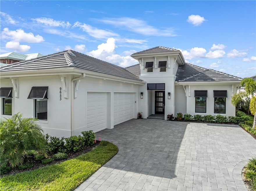 No need to wait for new construction—this brand-new, move-in-ready Easton 3 by Stock Development is available now in one of Naples’ most sought-after new communities, Caymas. Featuring 4 bedrooms, 3.5 baths, and 2,818 sq. ft. of beautifully finished living space, this residence is loaded with over $400,000 in luxury upgrades, offering contemporary finishes throughout and designed for immediate enjoyment.

Inside, an elegant great room flows into the dining area and a private den framed by clear-glass French doors. The gourmet kitchen stands out with extended cabinetry, under-cabinet lighting, a massive island with 2.5" mitered-edge Calcutta Laza quartz countertops, matching full-height backsplash, and premium KitchenAid appliances. A beautifully appointed wet bar—with backsplash and a Whirlpool wine refrigerator—elevates your entertaining options.

Throughout the home, the Paradise Island Collection of wide-plank European white oak flooring adds warmth and sophistication. Custom tile finishes accent each bathroom, while the fully upgraded laundry room features 30" cabinetry and Arvali Onyx Matte tile. Solid-core doors and LED low-profile canless lighting in all bedrooms and the den contribute to the home’s refined feel.

Step outside to an expansive outdoor living space featuring a custom pool and spa with a panoramic picture-window screen overlooking the lake’s western exposure. The pool is equipped with a Pentair Intellicenter salt system, gas heater, autofill, spa flush-to-deck, and sun shelf—perfect for relaxed afternoons and sunset views. A 3-car garage with epoxy flooring and full hurricane-impact windows and doors complete this exceptional property.

Living in Caymas means enjoying amenities that feel straight out of a luxury resort. The community’s impressive 18-acre clubhouse campus offers countless ways to relax, connect, and stay active. The centerpiece is a stunning 30,000-sq-ft social clubhouse featuring indoor and outdoor dining, a private dining room, golf simulator, billiards, and a private theater—ideal for spending time with friends, family, and neighbors. A full-time lifestyle director curates engaging events and activities, while an on-site tennis professional supports players of all levels with matches, clinics, and round robins.

Health and wellness enthusiasts will appreciate the fully equipped fitness center and open-air yoga lawn. Outdoors, residents enjoy eight pickleball courts, six tennis courts, a pro shop, bocce ball, cabana-lined resort and lap pools, a tiki lounge, and even a kayak launch for exploring the community’s scenic lakes.

Altogether, this exceptional home and community offer a lifestyle of comfort, convenience, and resort-style living that is truly unmatched in Naples.