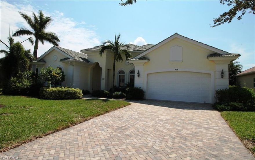 NOW available for showings.  Gorgeous 3 plus den pool and spa home on the lake.  One of the most coveted floor plans in Horse Creek Estates boasting over sized rooms and baths, volume ceilings, wide open floor plan and huge great room.  Horse Creek Estates is a small quiet enclave of home in North Naples.  Only minutes to beaches, shopping and dining.  Lawn Care, cable, pest control and internet all included in the HOA fees. This home is priced to sell!  This is the lowest priced per square ft single story pool home and on the lake as a bonus!  Unfortunately the owner can no longer enjoy their dream vacation home and are selling at a loss. Furnishings can stay or go. Their loss is your gain!  This home will not last.