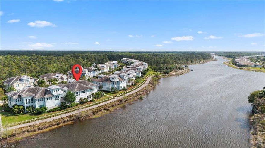 One or more photo(s) has been virtually staged, AI generated or rendered.  Welcome to the highly sought-after Hibiscus Retreat floor plan—an exceptional waterfront coach home offering breathtaking, unobstructed views of the Cypress River Waterway’s widest point with direct access to the Gulf of Mexico. Perfectly positioned just 90 feet from the water, this residence captures stunning daily sunsets and serene vistas from the kitchen, great room, sunroom, and 2 private balconies.

Boasting 2,781 square feet of thoughtfully designed living space, this rarely available home features 3 bedrooms, 3 full baths, a den/office, sunroom, and a versatile loft retreat. A private elevator provides seamless access to all three levels, enhancing both convenience and luxury.

Interior highlights include vaulted ceilings, crown molding, plantation shutters, and beautiful hardwood flooring throughout the main living areas. The gourmet kitchen is appointed with quartz countertops, while the spacious primary suite offers a walk-in closet and spa-like bath. Custom closets in guest bedrooms provide added functionality.

Built to stringent commercial standards, this coach home is fully sprinklered, equipped with impact glass, and located outside of a flood zone—offering peace of mind and low insurance costs. Additional features include a large two-car garage with extensive built-in storage and ceiling-mounted bike racks. A new HVAC system was installed in May 2022.

Located within the gated community of The Isles of Collier Preserve, residents enjoy resort-style amenities including a clubhouse, fitness center, pools and spa, tennis, pickleball, bocce, scenic walking and biking trails, waterfront dining, and a variety of outdoor activities such as kayaking and paddleboarding. Ideally situated just minutes from Old Naples, fine dining, shopping, art galleries, and pristine Gulf beaches.

Experience the perfect blend of luxury, nature, and coastal living in this extraordinary waterfront home.