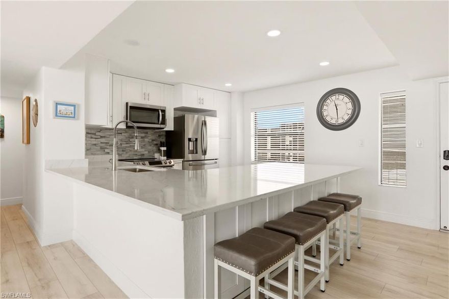 SELLER FINANCING AVAILABLE. Experience true coastal living in this fully renovated, corner-unit beachfront condo, ideally located directly on the sand in Bonita Beach. Enjoy breathtaking Gulf views and gentle ocean breezes from the largest open-air balcony on the beach—an exceptional feature perfect for relaxing or entertaining. This residence has been completely updated with attention to detail, including a new HVAC system, new water heater, and luxury vinyl plank flooring throughout. The kitchen and bathrooms have been beautifully remodeled with modern, high-end finishes, complemented by inset LED lighting in the kitchen, bathrooms, living area, and primary closet. Offered fully furnished with stylish décor and LED TVs, this condo is truly move-in ready.

A highly sought-after feature is the under-building parking space (valued at over $30,000), providing convenience and protection just steps from your front door. The floor plan is one of the most desirable on Bonita Beach, offering an open layout ideal for both everyday living and entertaining. Enjoy a more private beach setting, as this location is removed from public parking areas for a quieter, more peaceful experience. The community is undergoing significant enhancements, including a brand-new pool and spa coming soon, along with recent improvements such as a new roof (2023), fresh exterior paint, updated elevators, a renovated community room, and refreshed landscaping. An onsite manager ensures ease of ownership, all just 25 minutes from Southwest Florida International Airport and close to premier shopping and dining.