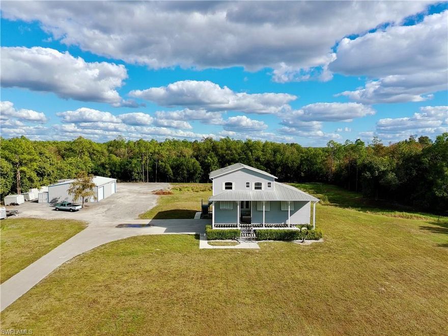 Rare opportunity to own 4.77 acres on central water in South Naples!  The Home features 3 bedroom suites with walk in closets, a volume ceiling, front & rear porches, and a 2400 sqft steel garage (built in 2019).  The property is fenced in, features a lake, and on a dead end road offering privacy.

The home is conveniently located near Marco Island, Manatee Elementary and Manatee Middle School, as well as shops, dining, and golf courses.