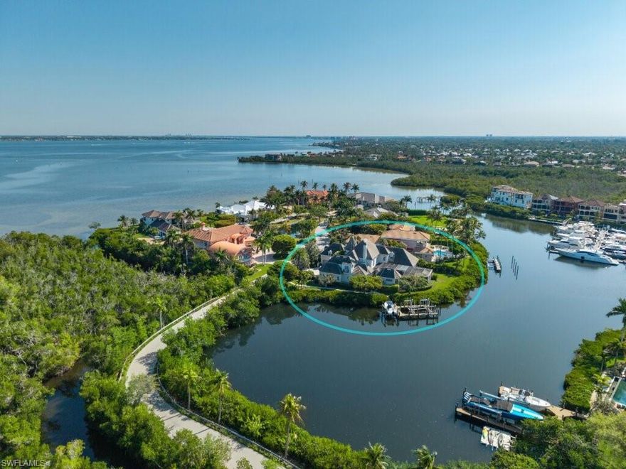 Experience timeless elegance and exceptional waterfront living in this custom-designed French Colonial estate by renowned architect Bud Lawrence. The home is ideally situated on a private, one-acre homesite within the prestigious gated community of St. Charles Harbour Yacht Club. Located on Waite Island, a private exclusive enclave within St. Charles that 1 of only 8 enjoy. Surrounded by serene waterways and offering deep-water boating access, this property is a rare blend of architectural beauty, privacy, and lifestyle. From the moment you arrive, the home’s charm is undeniable — featuring a grand courtyard and striking architectural elements and details throughout. Inside, the dramatic foyer opens to soaring 25-foot coffered ceilings and a breathtaking 20-foot stone fireplace wall, complemented by intricate faux finishes, custom columns, and elegant wrought iron accents. Designed for both refined living and entertaining, the home offers a gourmet kitchen with butler’s pantry, spacious family room, formal living areas, and a private office with custom cabinetry and library walls. A dedicated media room with full bar, wine cellar, and private elevator further elevate the experience. The residence features five bedrooms, including an impressive VIP suite with dual baths, along with a separate cabana guest suite — ideal for hosting guests or creating a private retreat. Step outside to enjoy incredible water views from nearly every angle, with expansive outdoor living spaces and a private dock equipped with two boat lifts — perfect for accommodating multiple vessels and enjoying direct deep-water access to the Gulf. Located just minutes from Sanibel and Fort Myers Beach, as well as shopping, dining, the airport, and top schools, this home offers both convenience and exclusivity. Residents of St. Charles Harbour also enjoy access to a private marina, clubhouse, tennis, and pickleball. A truly exceptional opportunity to own a private waterfront estate where luxury, boating, and timeless design come together.