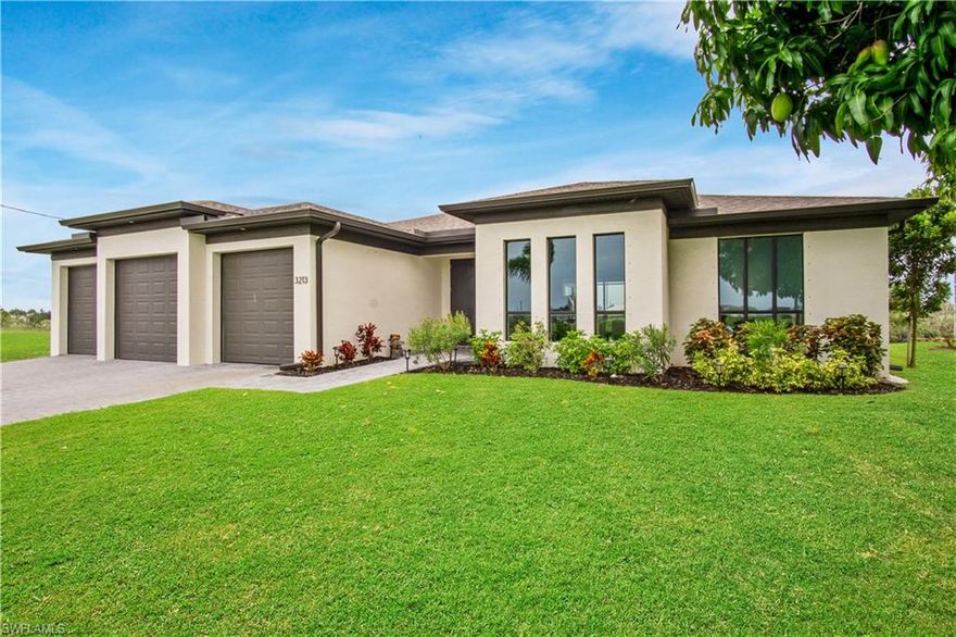 Paradise awaits you in this modern gulf access pool home in Cape Coral. With three bedrooms plus a bonus room that you can use as a den or family room there is plenty of space for your family or guests. There is a large and wide-open great room with an adjoining modern kitchen with stainless steel appliances, granite countertop, waterfall center island and all wood cabinetry. Sliding glass doors open out to the large under truss lanai and pool area. Very recent upgrades to the home include a 10,000# covered boat lift, 2 boat slips with captain's walks, water and electric at the dock, paver patio and retaining wall with steps from the waterfront to the lanai, pool heater, coffee / wine bar with cooler and electric sauna. Tasteful landscaping includes 4 Royal Palm Trees, 2 triple trunk palms & a Bizmark tree. Furniture included! Make your appointment today.