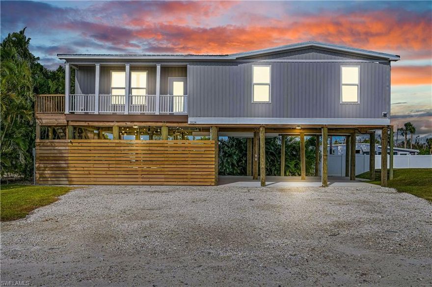 This 2024-built 3-bedroom, 2-bath stilt home offers 1,518 square feet of modern coastal living and is built like it plans to be here a while. The oversized pilings are driven approximately 25 feet into the ground, providing serious structural confidence and peace of mind. Elevated, well-built, and thoughtfully designed, this home checks both the practical and aesthetic boxes. It has never been lived in full time, and yes—it still has that unmistakable “new home smell” you don’t usually get in resale homes.

Inside, you’ll find a bright, open-concept floor plan with a spacious great room and a stylish kitchen featuring stainless steel appliances, ample cabinetry, and a large island perfect for entertaining, meal prepping, or pretending you’re on a cooking show. The split-bedroom layout offers privacy, with three generously sized bedrooms and two modern bathrooms finished with clean, contemporary touches. Natural light fills the home, and the elevated setting adds both airflow and charm.

Downstairs, the covered area provides flexible space currently set up with a spa and seating—ideal for post-fishing relaxation, evening cocktails, or just enjoying the fact that you don’t live in a snowstorm. Parking is conveniently located in front of the home, and the stilt design makes excellent use of space while enhancing the coastal lifestyle.

Situated near the highly desirable Henley Canal—one of the most active canals in St. James City—the home offers a front-row seat to daily boat traffic, island vibes, and authentic Pine Island living. You’re within walking distance to restaurants, waterfront bars, fishing spots, and all the local flavor that makes this area special.

The home is currently set up for and actively operating as a vacation rental and can continue as such with new ownership, making it a rare find that works just as well as an investment as it does a personal retreat. Whether you’re looking for a primary residence, a seasonal escape, or a property that pays for itself while you’re not using it, this one delivers—with a little personality to match.
