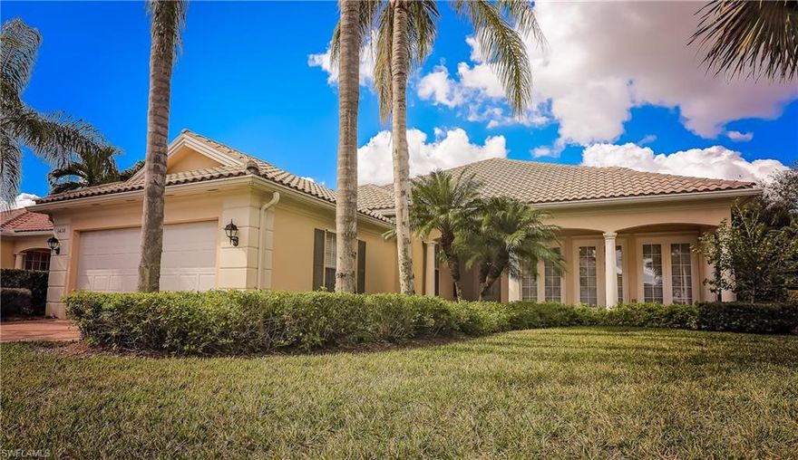 Spotlessly Clean and Bright Carlyle model home with four spacious bedrooms and 3.5 bath with a large heated pool overlooking a lake.  This home features a covered front porch, central vacuum system, shelving built-in in the family room, fireplace in the living room, whirlpool tub in the master bathroom.  Newer Hot Water Heater, Washer/Dryer and Refrigerator.  Very well maintained and ready to move in located in the gated community of Island Walk which has great amenities at the Town Center.  Call today for your private showing.