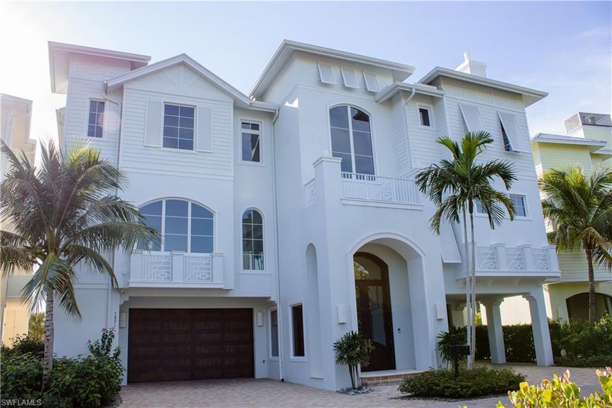 There is no other luxury Bonita Beach estate on the market that can offer boating and Beach proximity in a gated neighborhood. This recently remodeled and newly furnished home has everything for the boating and beach lifestyle. This stunning 4 bedroom + den home has 3 floors of living space with a private elevator. The first floor features a finished den or bonus space plus 2 air-conditioned garages, and tons of storage for all the toys. The second floor features a large open space ideal for entertaining or decompressing after a fun day in the sun, professionally furnished for comfortable living with a large kitchen and 2 islands. The first of 4 bedrooms can also be found on this floor, en-suite and strategically located with the first of 2 laundry spaces. The third floor features the remaining 3-bedroom suites with balconies, a breakfast bar, and the second laundry room. The Master suite is spacious and boasts 2 huge walk-in closets and a stunning bathroom.  Enjoy a private dock with Southern exposure and white sandy beach just steps from your front door.