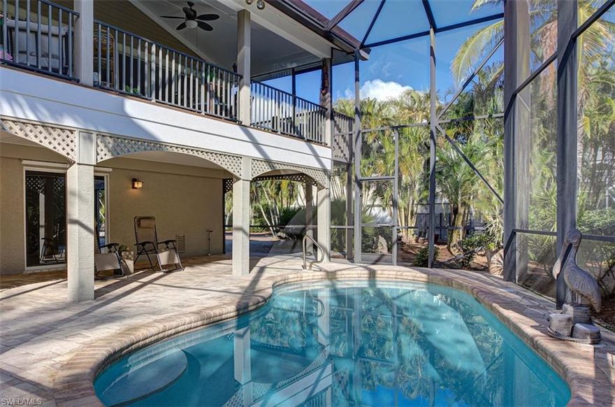 Beautiful, private layout adjoining conservation land in this three bedroom, two and one half bath split entry raised ranch style home in the Dunes Golf & Tennis Club. Gorgeous over-sized tile floor flows throughout the living room, dining room & kitchen. Living room boasts vaulted ceilings, art ledge, & beautiful custom built-ins. Fully retractable glass sliders allows the living room to be open completely to the screened lanai providing southern exposure to the heated pool. Kitchen boasts solid surface countertops, custom wood cabinetry, tile backsplash & new stainless steel appliances. Master suite opens to the lanai & the spacious master bath has double sinks, separate tub/shower & walk-in closet. Split floor plan provides additional privacy w/ 2 guest rooms & a beautifully appointed guest bath. Conveniently located near the causeway allowing for easy off-island access, the Dunes Golf & Tennis Club offers a semi-private golf course, pool, tennis, clubhouse & restaurant.