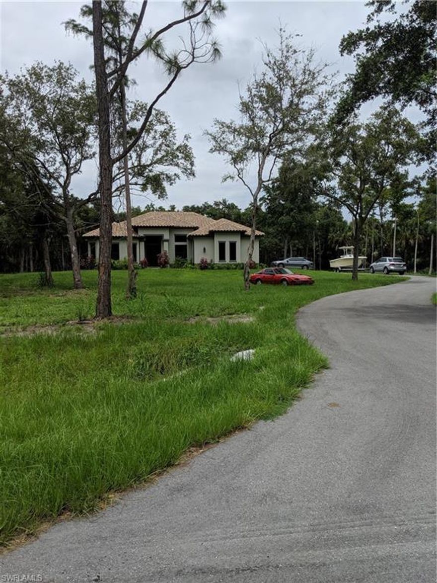 Beautiful five acre parcel in area of new homes in the hottest area in Collier County.   This is one of the nicest lots available in this area on a newly paved street with large oaks, palm, cedar and pine trees throughout.  Several large homes currently under construction on this street, come out and see why.    Lot could be split and two homes could be built.   City water and sewer are available on this street - save lots of $$ .    Minutes from Bird Rookery, new 150 acre park being built, Ave Maria and  new Charter School. 30 minutes from Naples famous white sandy beaches.