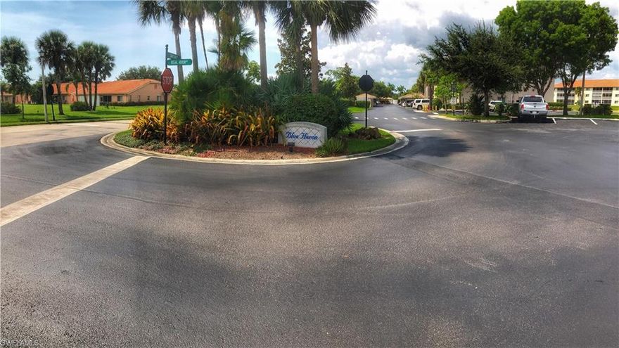 Immaculately kept, Beautiful First floor condo in neutral colors, with a serene view of the preserve.  This 2 bedroom, 2 bath condo offers an open and spacious floor plan with many extras: Quartz counter tops & backsplash, stainless kitchen appliances, convection oven and  microwave (most only 2 years old), seamless glass shower door in masterbath (2017), Pergo flooring in Great room, both Bedrooms and closets, tile in main living areas- NO CARPET. New air conditioner (2016), water heater (2018), washer & dryer (2016), dishwasher (2015).  There is a sliding screen at your front door for those great full house cross-breezes and an electric hurricane shutter on the lanai.  This gated community offers a heated pool, clubhouse, lending library, streetlights and sidewalks.   Close to shopping and restaurants, approximately 5 miles from downtown 5th Ave Naples and the sandy beaches.  Private tiled lanai with ceiling fan to enjoy your morning coffee or evening cocktails.  Your covered carport is outside your front door and there is plenty of parking for your guests.  Don't let this one get away!!