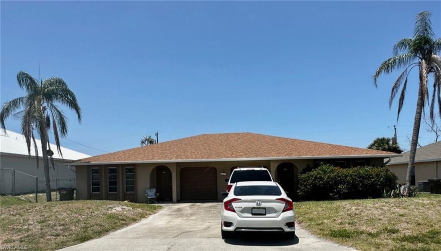 Now available for your income portfolio! 1980 Duplex in the heart of Cape Coral with Two bedrooms & Two bathrooms on each side. Each side also has a GARAGE and screened Lanai! 2018 Roof. This unit needs TLC and is offered AS IS. Long-term tenants are in residence at $1200 each per month and they pay all utilities. Tile floors throughout, and all appliances convey. Photos of the left side (520) will be posted soon. Ideally located near shopping, dining, schools, and health care to attract good tenants. Check this one out today!
