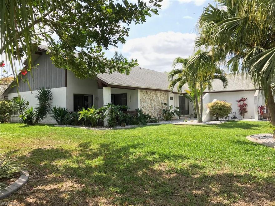 Custom home, unique with a 32 feet solar-heated pool in a lanai extending across the entire back of the home in the most desirable neighborhood in Cape Coral.  With cathedral ceilings, seven shatterproof sliding glass doors, and skylights providing plenty of natural light, this dream home will welcomes you with an elegance with a roomy undertone.  Upgraded kitchen with custom cabinets, granite counters, stainless steel appliances and breakfast bar.  Oversized master bedroom with sliders leading out to the lanai.  Separate shower and tub/shower combo and dual glass bowls atop granite counters in Master Bath.  Along with its screened lanai, this house has a secluded side porch with a beautiful sitting area facing a well maintained garden, mature landscaping and fruit trees.  Tile throughout; termite prevention system; new roof in 08/13/2010; AC system replaced on 11/04/2014; a new fence installed in 02/25/2011; and plumbing in 01/30/1995.  Furniture is negotiable.